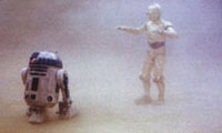 r2d2 et c3po emergeant de la tempete de sable